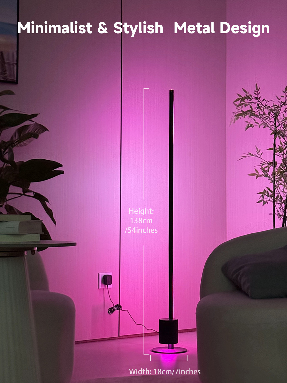 A minimalist metal floor lamp with a slim black pole and cylindrical base, shown in a modern living room setting with pink ambient lighting. White text overlays display dimensions: height of 138cm (54.